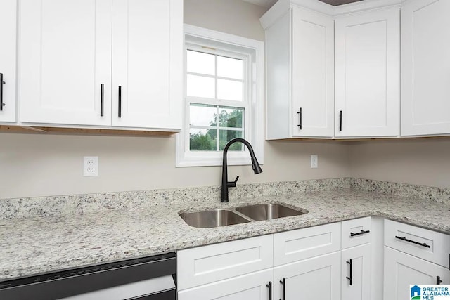 kitchen featuring white cabinetry, sink, and white dishwasher