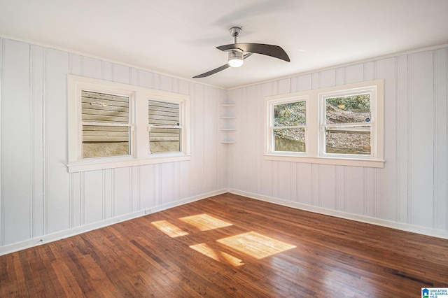 empty room featuring ceiling fan and hardwood / wood-style floors