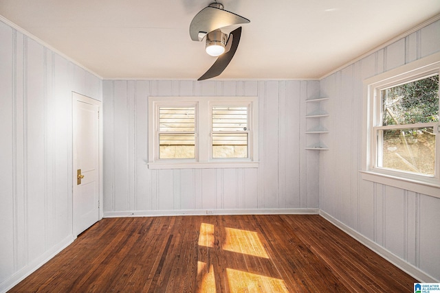 unfurnished room featuring dark hardwood / wood-style flooring