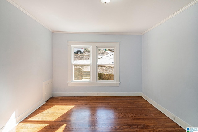 unfurnished room with crown molding and hardwood / wood-style flooring