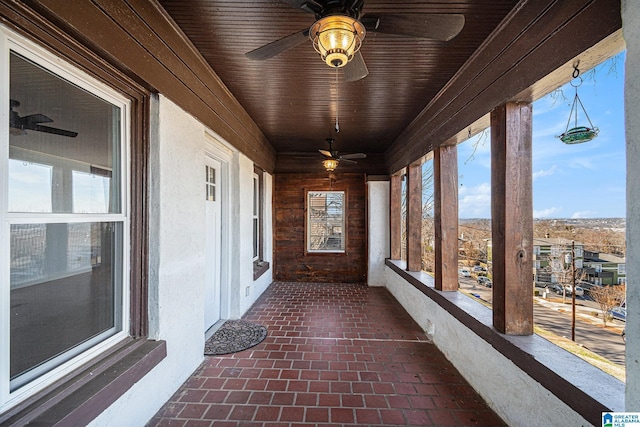 unfurnished sunroom featuring wood ceiling