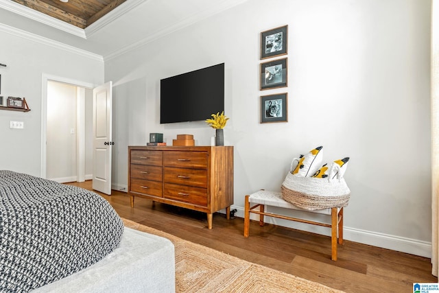 bedroom featuring hardwood / wood-style flooring and ornamental molding