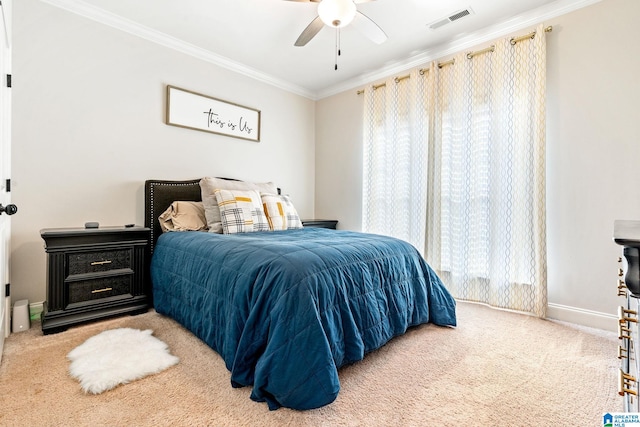 bedroom with multiple windows, ornamental molding, carpet floors, and ceiling fan