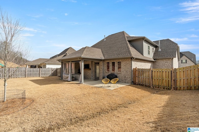 back of house with a patio area