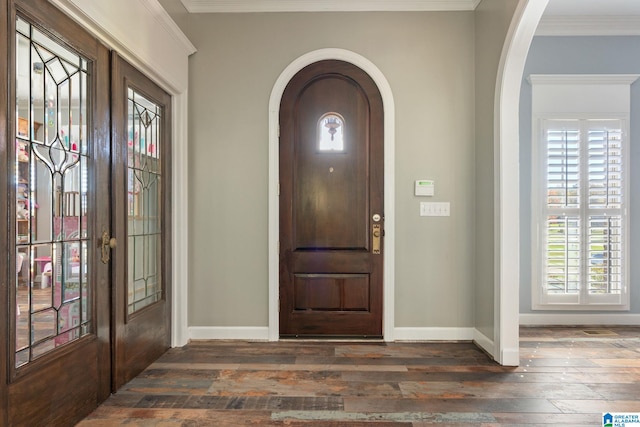 foyer entrance featuring french doors, ornamental molding, and dark hardwood / wood-style floors