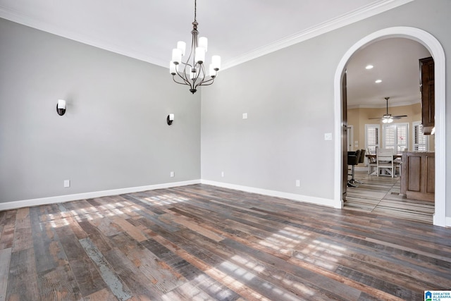 spare room with crown molding, ceiling fan with notable chandelier, and dark hardwood / wood-style floors