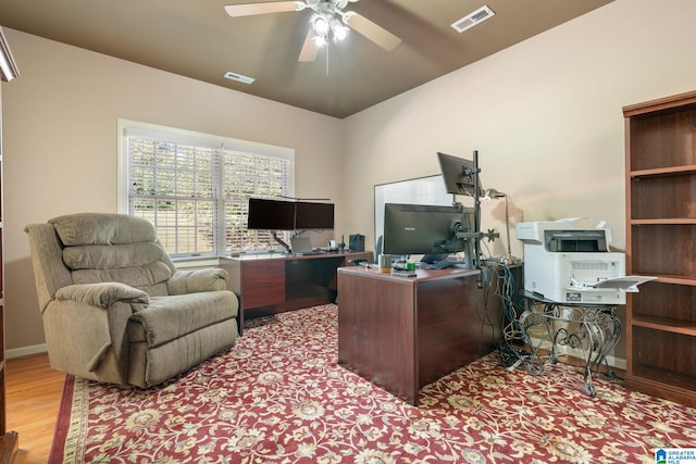 office area with light hardwood / wood-style floors and ceiling fan