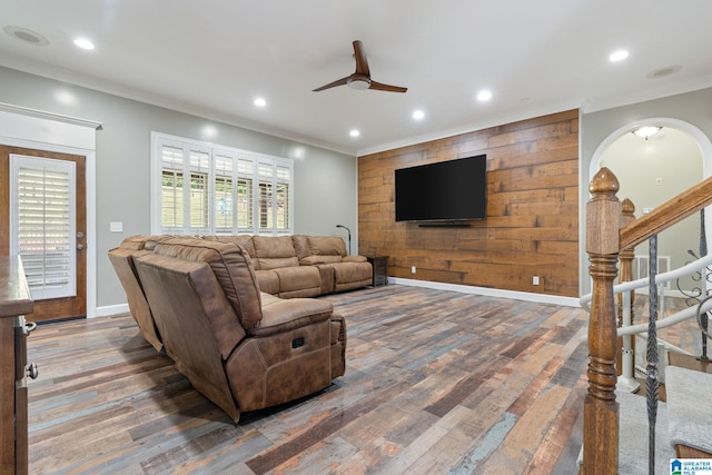 living room featuring crown molding, ceiling fan, and hardwood / wood-style floors