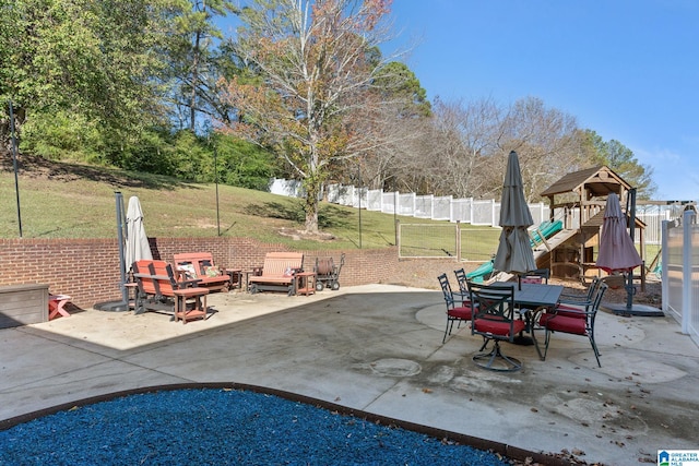 view of patio featuring a playground