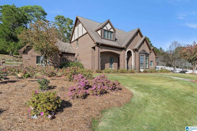 tudor house with a front yard