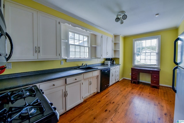 kitchen featuring white cabinetry, wood-type flooring, sink, and black appliances