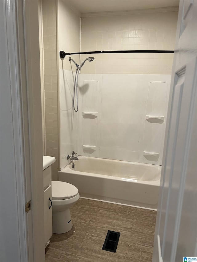 full bathroom with vanity, hardwood / wood-style flooring, shower / washtub combination, and toilet