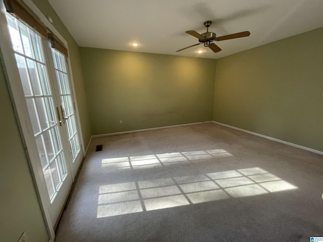 empty room with light carpet and ceiling fan