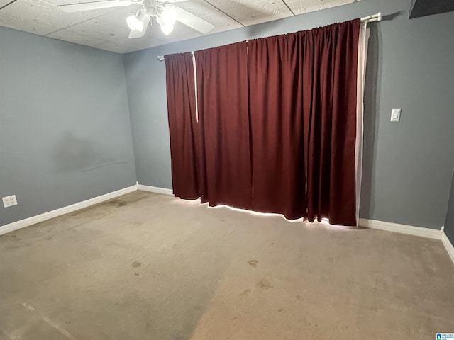 spare room featuring ceiling fan and carpet flooring