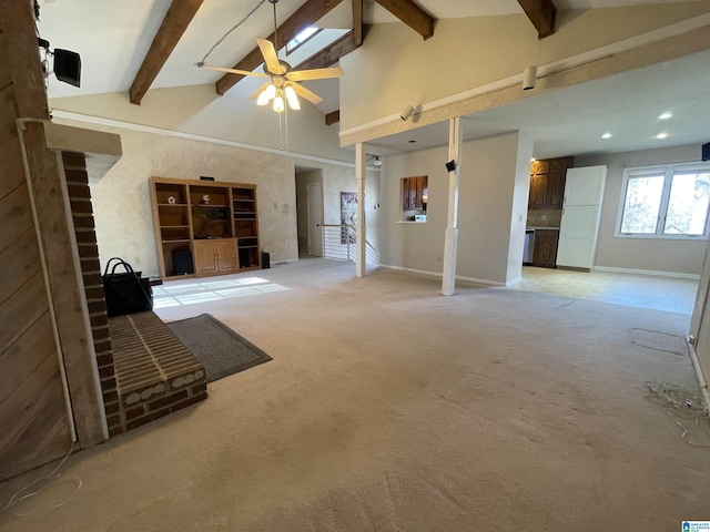 unfurnished living room with ceiling fan, high vaulted ceiling, light colored carpet, and beamed ceiling