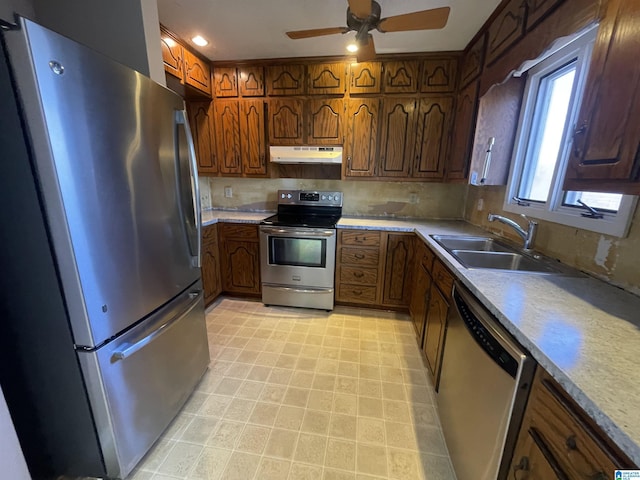 kitchen featuring sink, stainless steel appliances, and ceiling fan