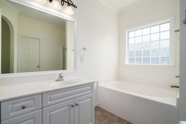 bathroom featuring tile patterned flooring, a tub to relax in, crown molding, and vanity