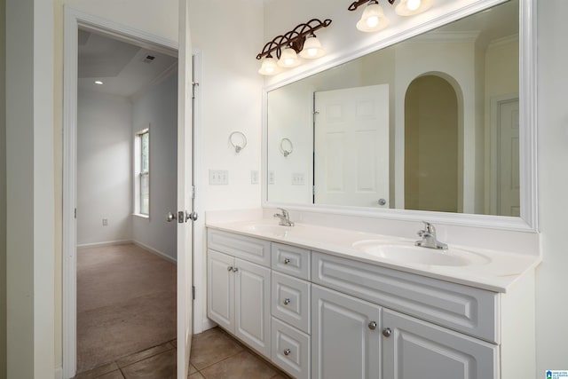 bathroom featuring tile patterned flooring, vanity, and ornamental molding