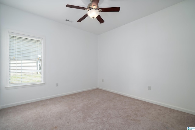 unfurnished room with light carpet and ceiling fan