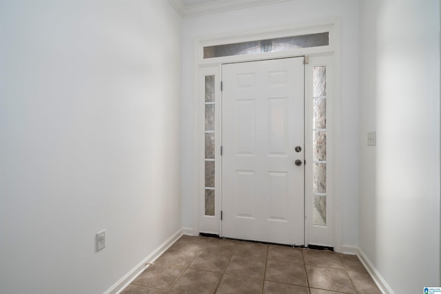 tiled entryway with ornamental molding