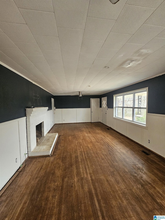 unfurnished living room with dark hardwood / wood-style floors