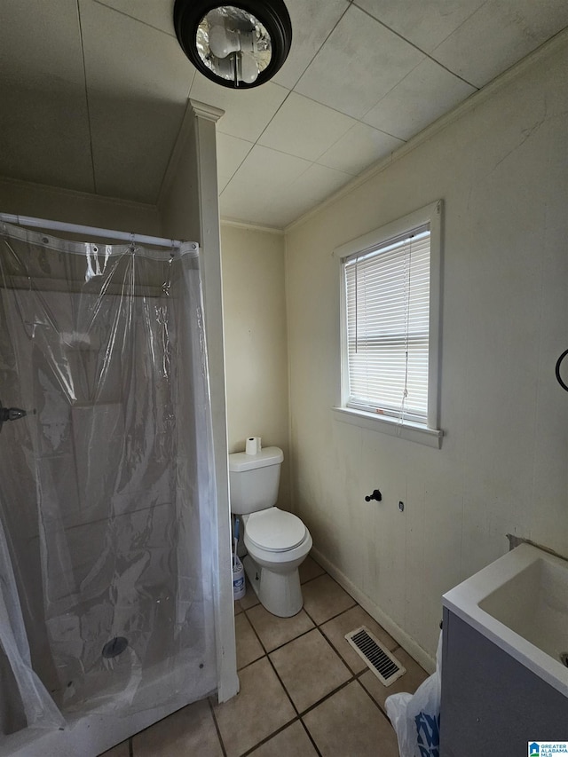 bathroom with tile patterned floors, toilet, a shower with curtain, ornamental molding, and vanity