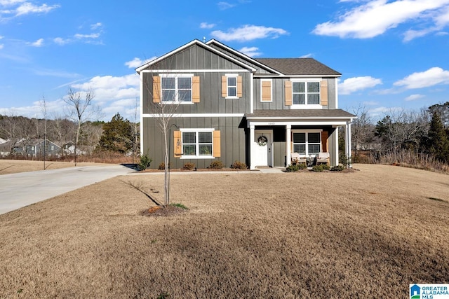 view of front of property featuring a porch and a front yard