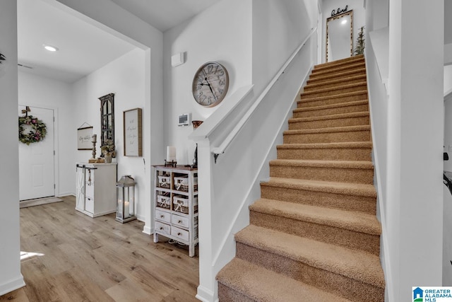 stairs with wood-type flooring