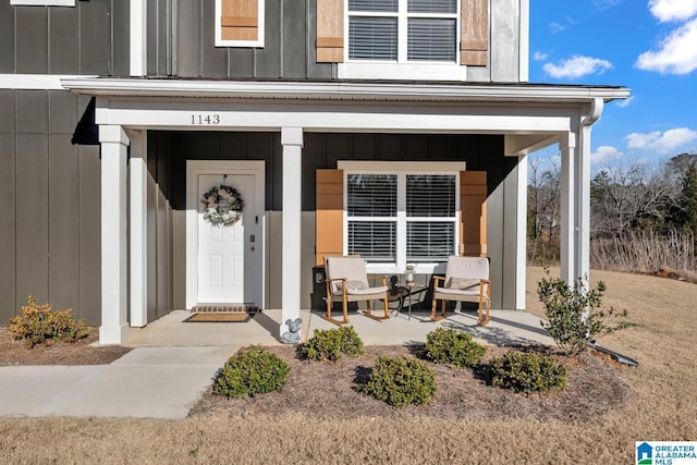 entrance to property featuring covered porch