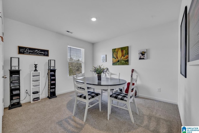 view of carpeted dining space