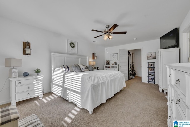 bedroom with light carpet and ceiling fan