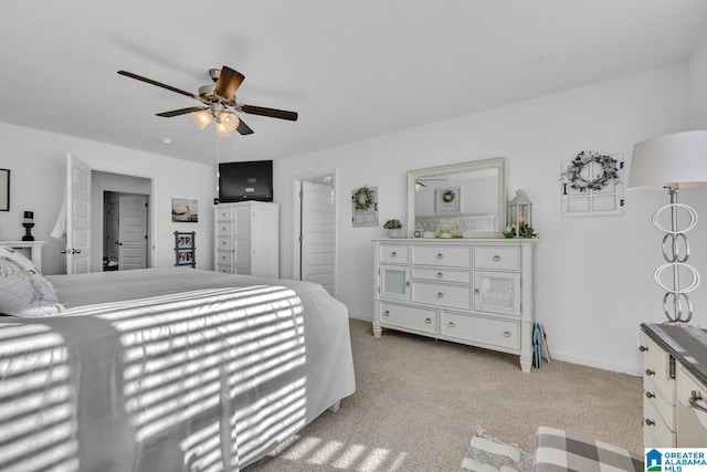 bedroom with ceiling fan and light colored carpet