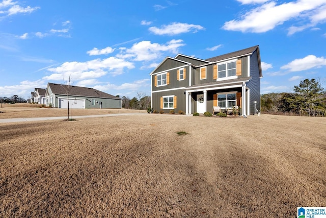 view of front facade featuring a front yard and covered porch