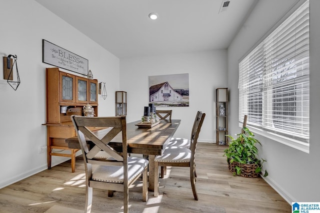 dining space featuring light hardwood / wood-style floors