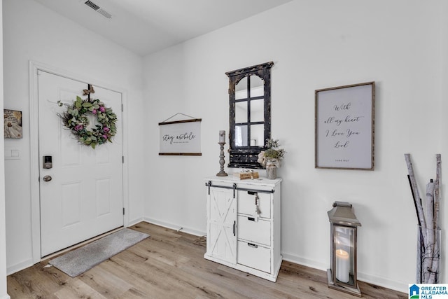 foyer entrance featuring light wood-type flooring