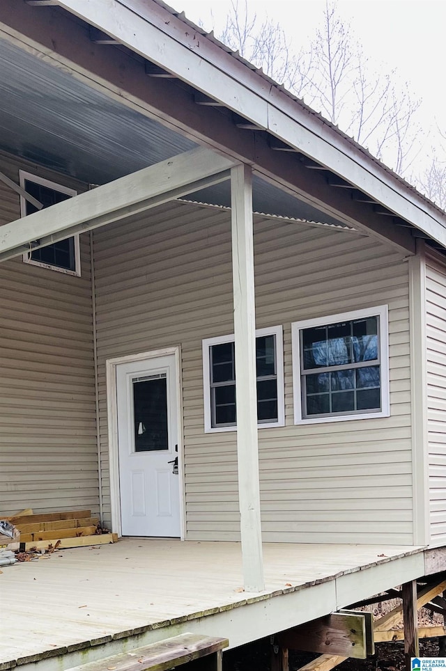 property entrance with a deck