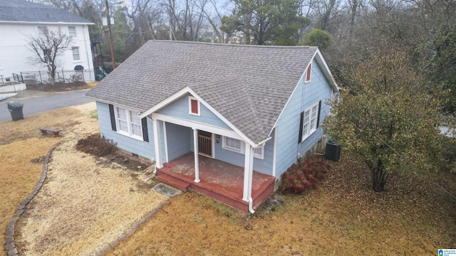 view of front of house with central AC and a porch