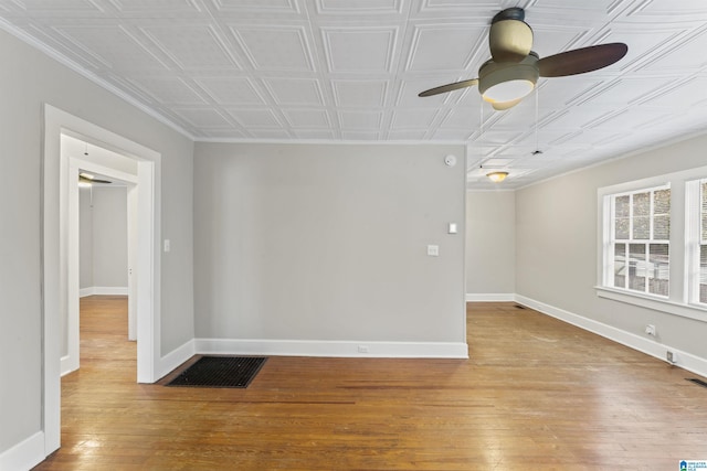 empty room featuring ceiling fan and light hardwood / wood-style flooring