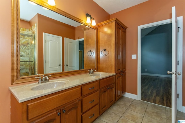 bathroom featuring tile patterned floors and vanity