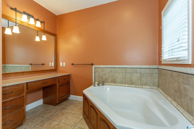 bathroom featuring tile patterned flooring, vanity, and a washtub