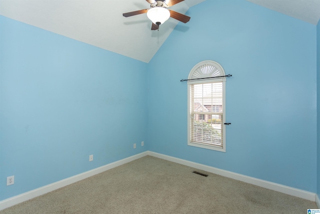 carpeted spare room featuring ceiling fan and high vaulted ceiling