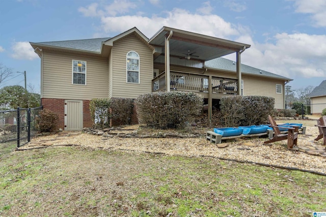 rear view of house featuring ceiling fan