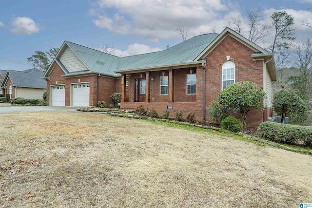 view of front of home with a garage, a front lawn, and a porch