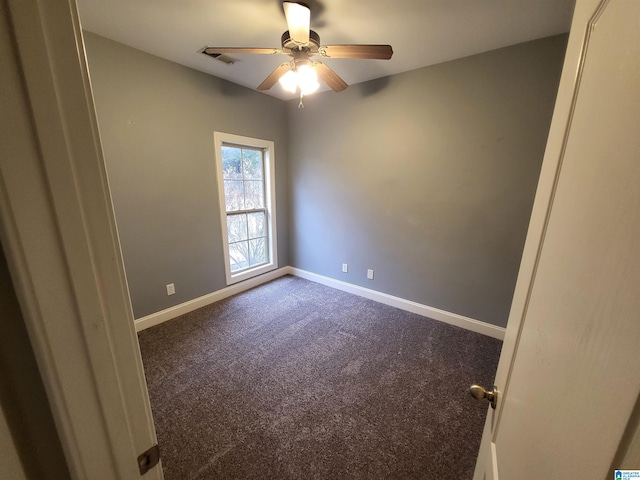 empty room featuring ceiling fan and carpet floors