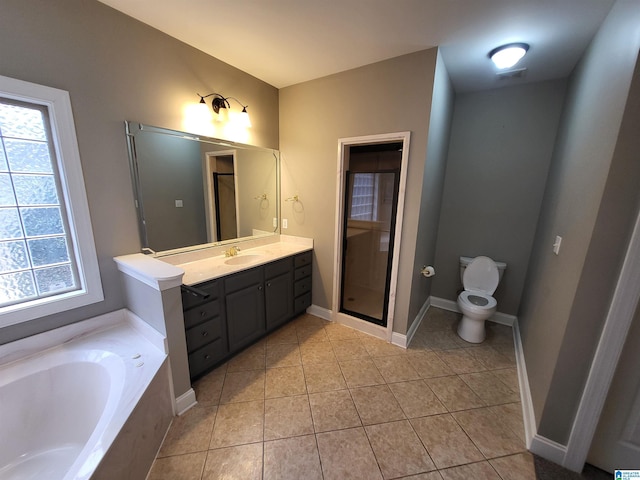 full bathroom with vanity, tile patterned floors, toilet, and separate shower and tub