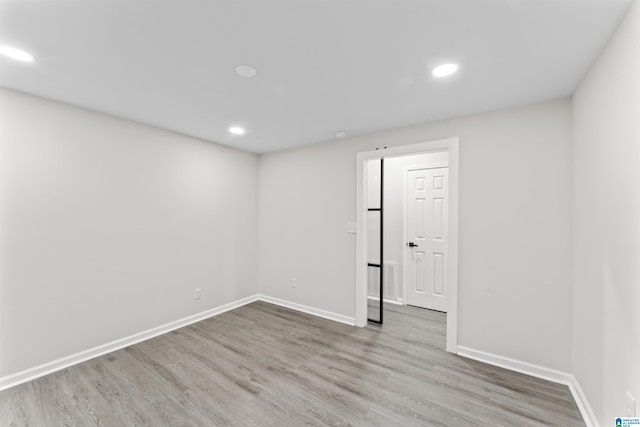 empty room featuring hardwood / wood-style flooring