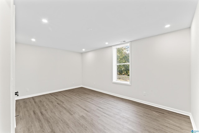 spare room with hardwood / wood-style floors