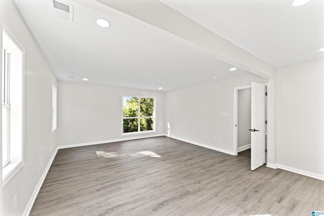 unfurnished room with light hardwood / wood-style floors