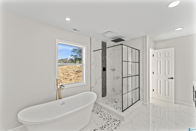 bathroom with separate shower and tub