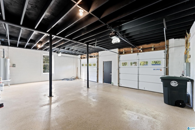 garage featuring water heater and a garage door opener